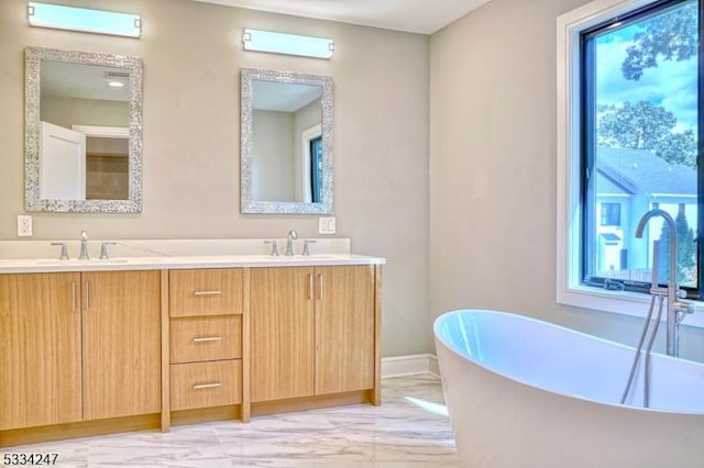 bathroom with vanity and a bathing tub