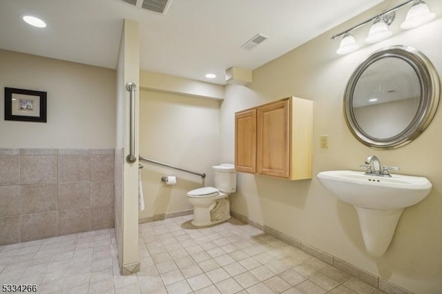 bathroom with tile patterned floors and toilet