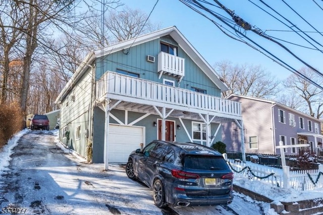 view of front facade with a balcony and a garage