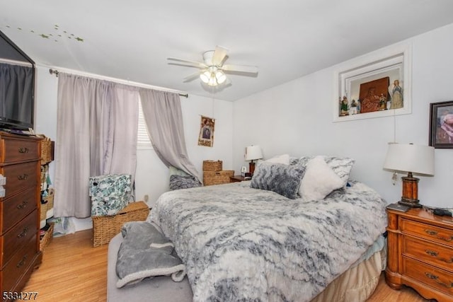 bedroom featuring ceiling fan and light hardwood / wood-style flooring