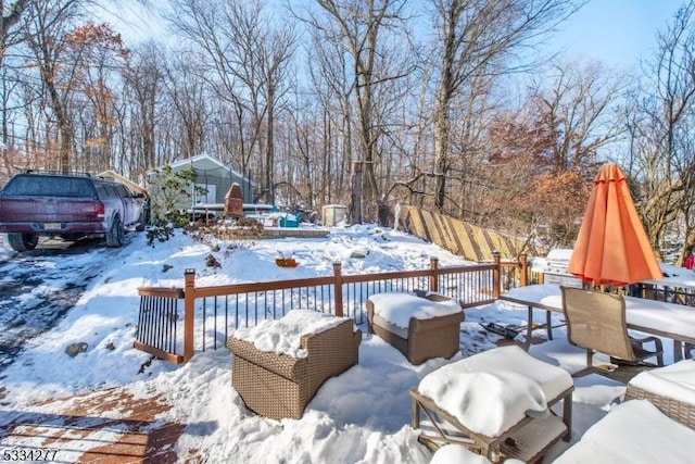 view of snow covered deck