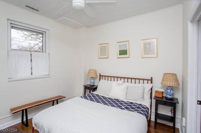 bedroom with dark wood-type flooring and ceiling fan