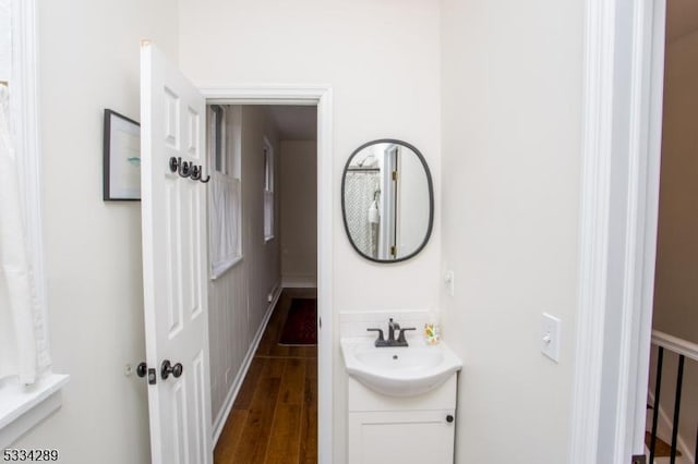 bathroom with vanity and hardwood / wood-style flooring