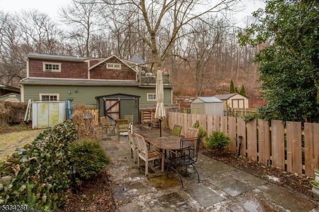 view of patio featuring a storage shed