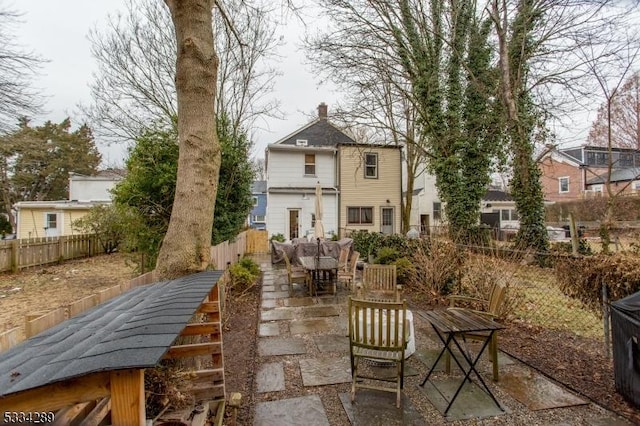 back of property with a patio