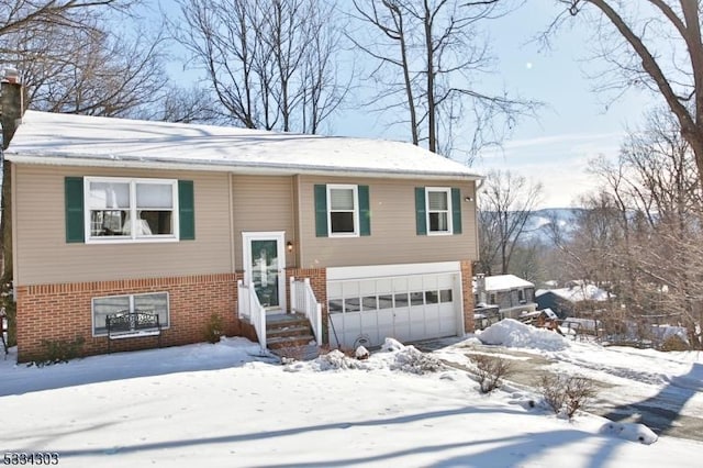 split foyer home featuring a garage