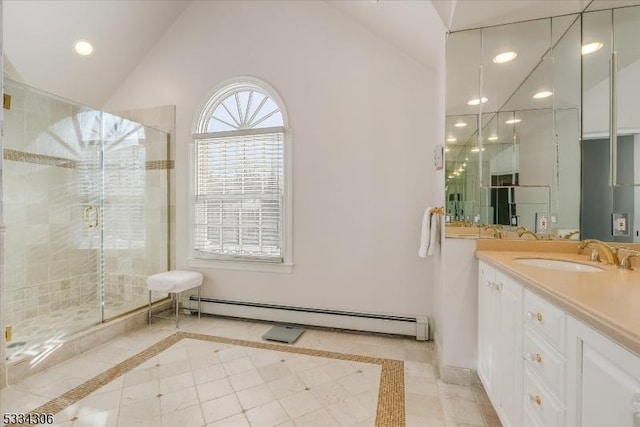 bathroom featuring a shower with shower door, lofted ceiling, vanity, baseboard heating, and tile patterned floors