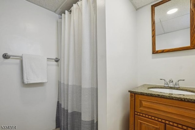 bathroom with vanity and walk in shower