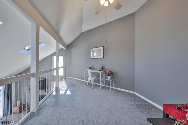 interior space featuring vaulted ceiling, carpet flooring, and ceiling fan