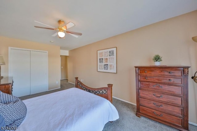 carpeted bedroom featuring ceiling fan and a closet