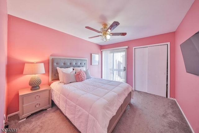 carpeted bedroom with ceiling fan and a closet