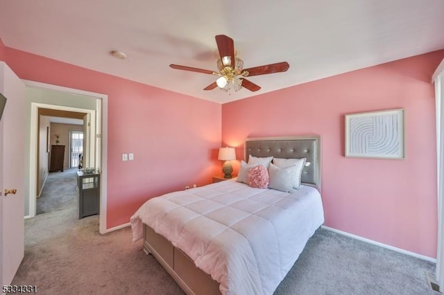 carpeted bedroom with ceiling fan