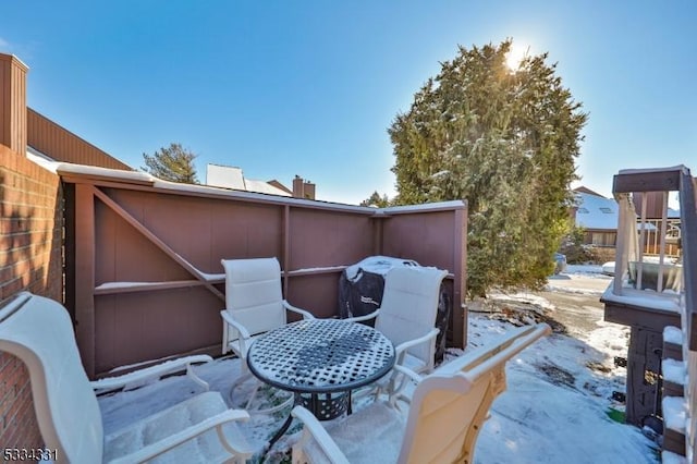 view of snow covered patio