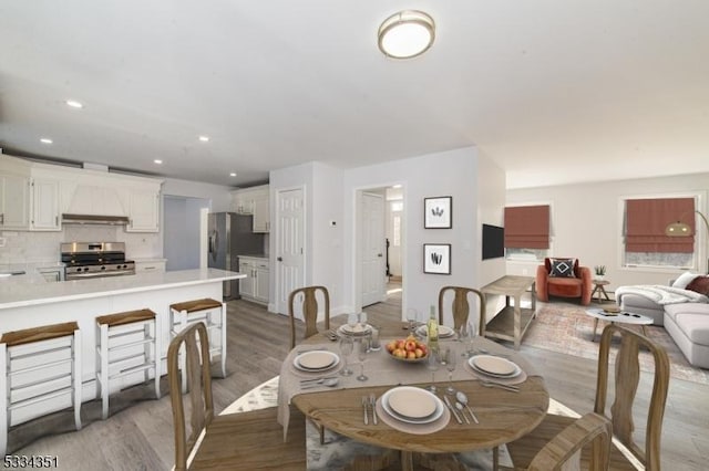 dining room with light wood-type flooring