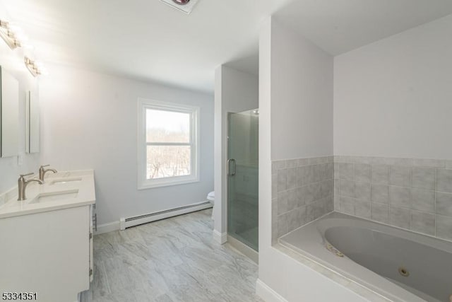 full bathroom featuring vanity, shower with separate bathtub, baseboard heating, and toilet