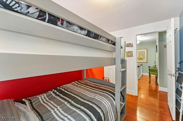 bedroom with hardwood / wood-style flooring