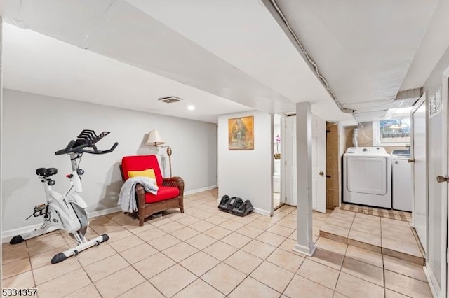 basement featuring washing machine and clothes dryer