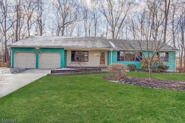 ranch-style house featuring a garage and a front yard