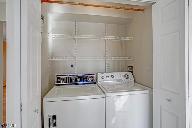 washroom with separate washer and dryer