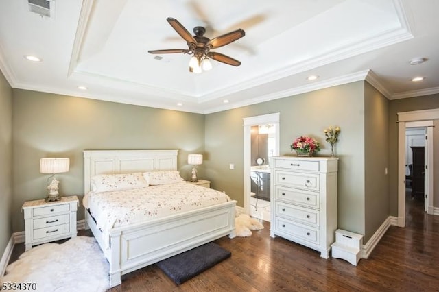 bedroom featuring dark wood-type flooring, ceiling fan, ornamental molding, and a raised ceiling