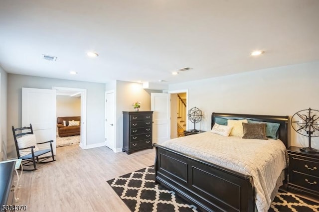 bedroom with light hardwood / wood-style floors