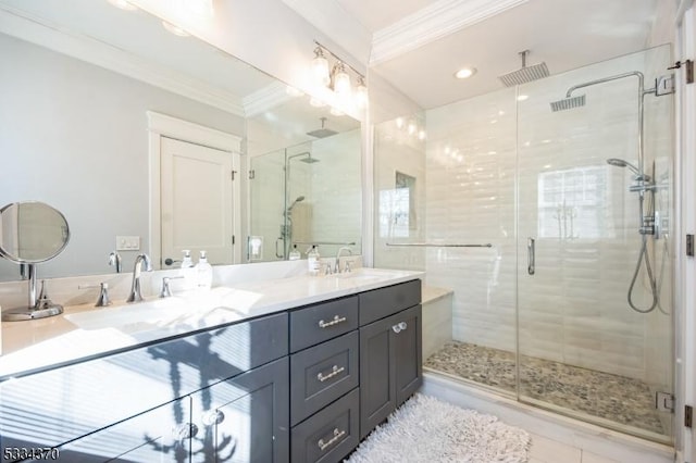 bathroom featuring crown molding, vanity, and a shower with door