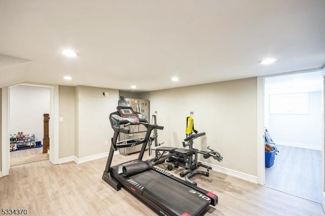 workout area featuring light wood-type flooring