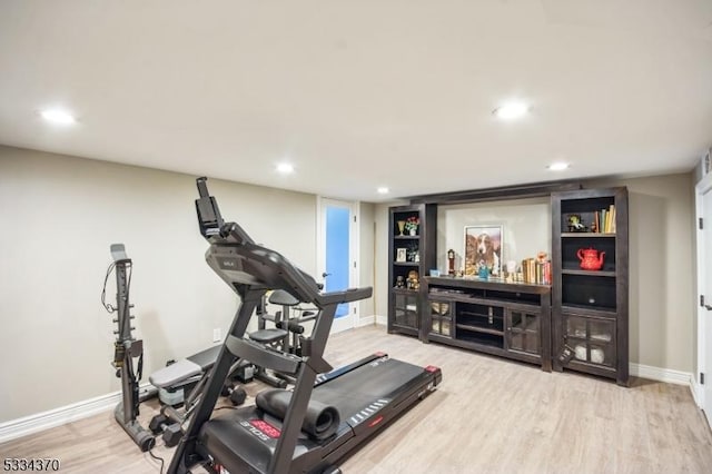 workout area featuring hardwood / wood-style flooring