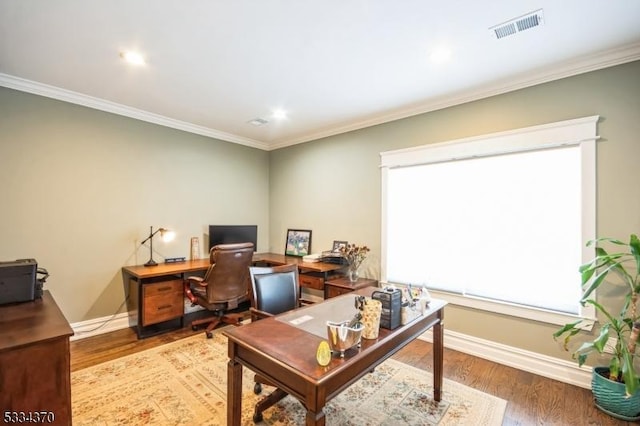 home office featuring wood-type flooring and ornamental molding