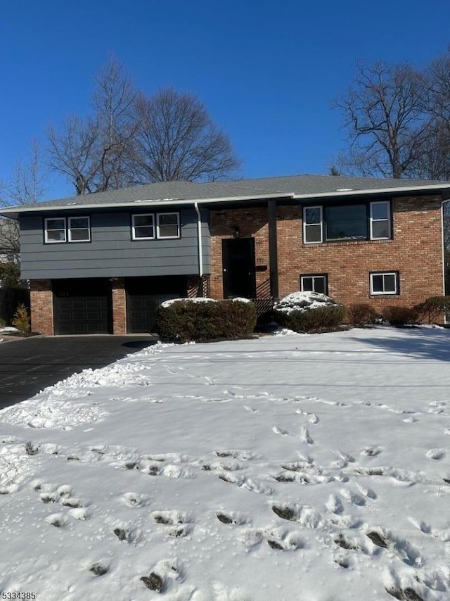 bi-level home featuring a garage