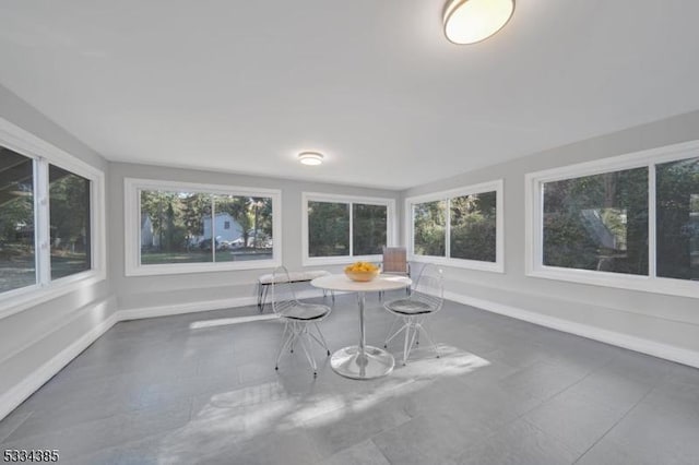 unfurnished sunroom with a wealth of natural light