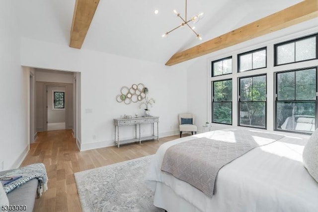 bedroom with beamed ceiling, high vaulted ceiling, an inviting chandelier, and light hardwood / wood-style flooring