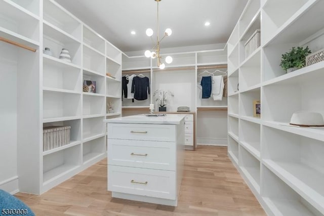 walk in closet featuring light wood-type flooring