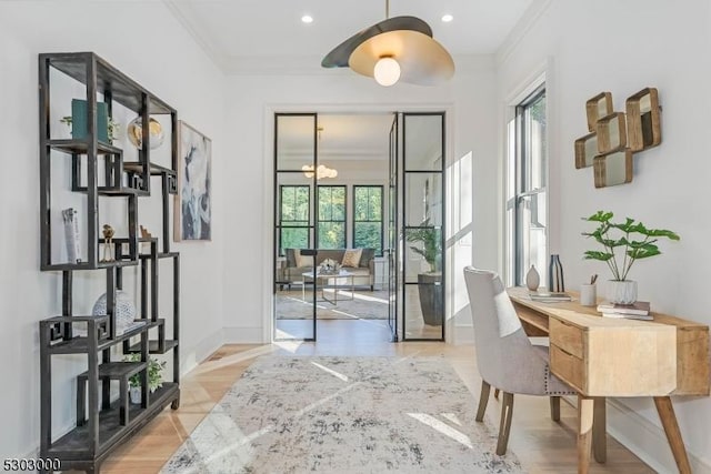 interior space with crown molding and a chandelier