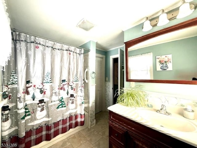 bathroom with vanity, shower / bath combination with curtain, and crown molding