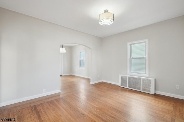 unfurnished room featuring light hardwood / wood-style flooring