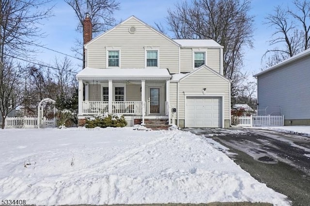 view of front of property featuring a garage and covered porch