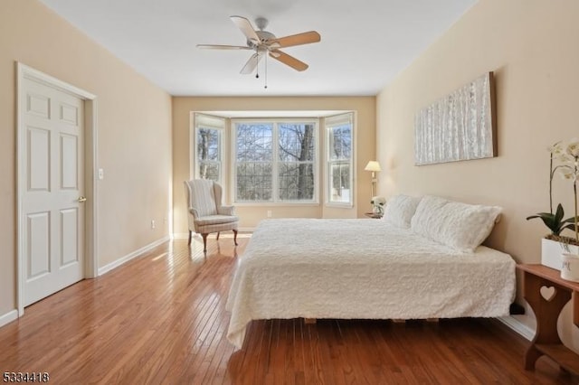 bedroom with ceiling fan and light wood-type flooring