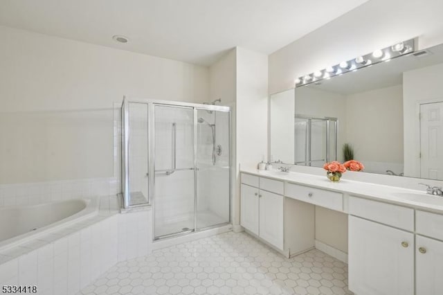 bathroom featuring independent shower and bath and vanity