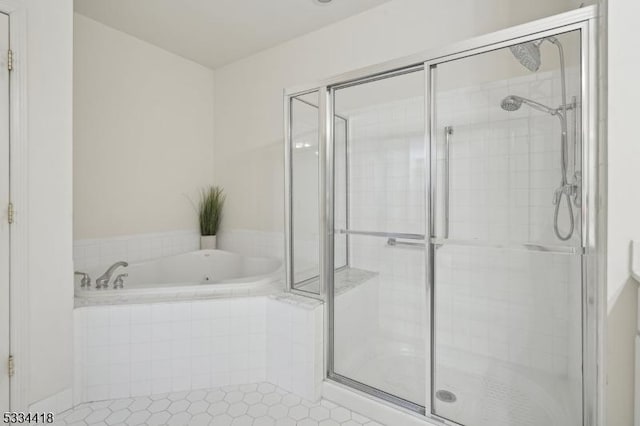 bathroom with plus walk in shower and tile patterned floors