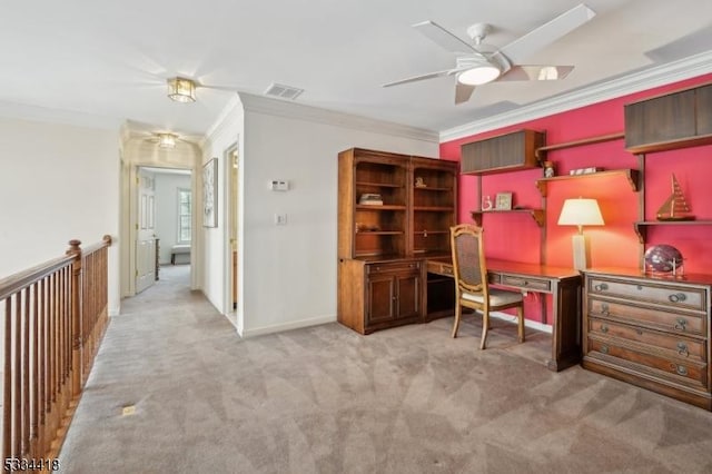 carpeted office space with ceiling fan and ornamental molding