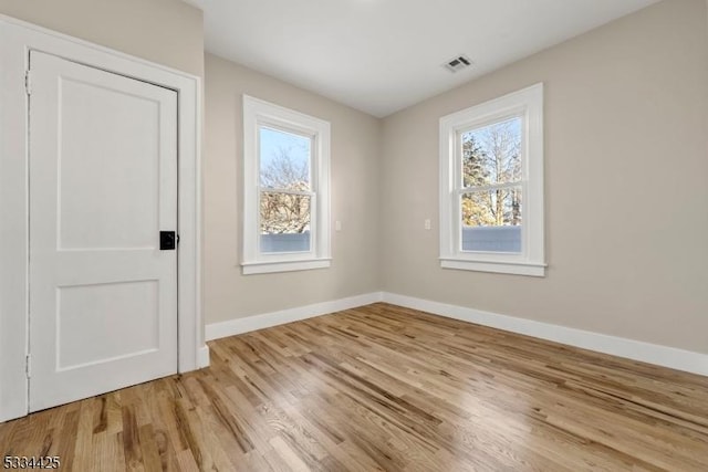 empty room with light wood-type flooring