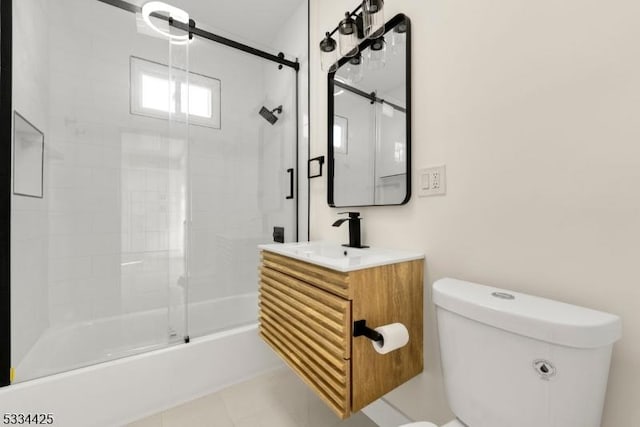 full bathroom featuring tile patterned flooring, enclosed tub / shower combo, vanity, and toilet