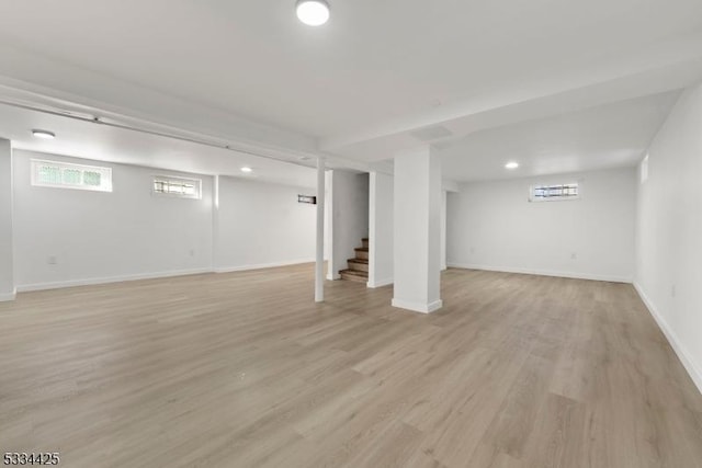 basement featuring light hardwood / wood-style floors