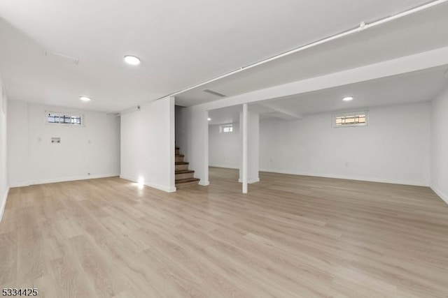 basement featuring light hardwood / wood-style flooring