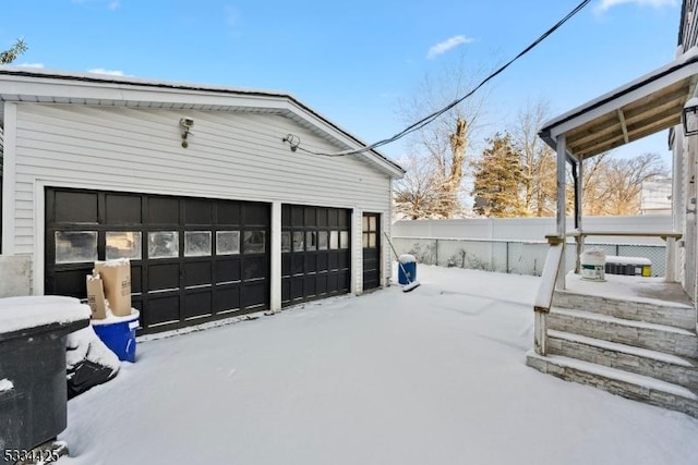 view of snow covered garage