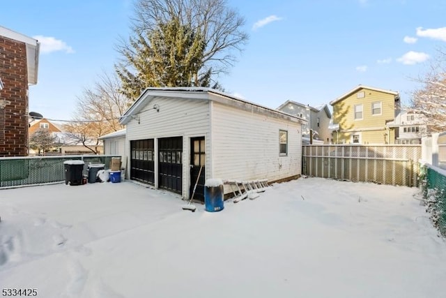 exterior space with an outbuilding and a garage