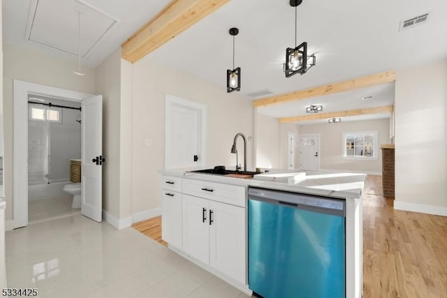 kitchen featuring sink, hanging light fixtures, dishwasher, a kitchen island with sink, and white cabinets