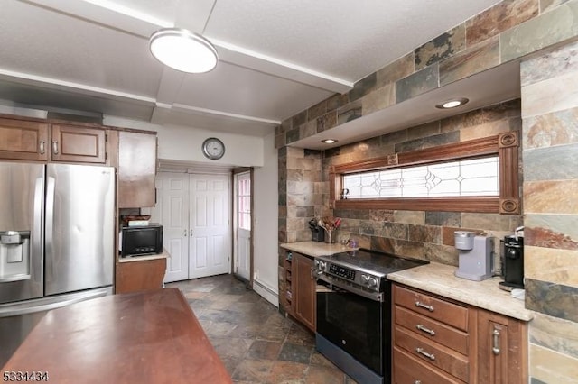 kitchen with tasteful backsplash and stainless steel appliances