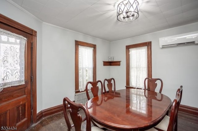 dining room featuring ornamental molding, plenty of natural light, a wall unit AC, and a notable chandelier